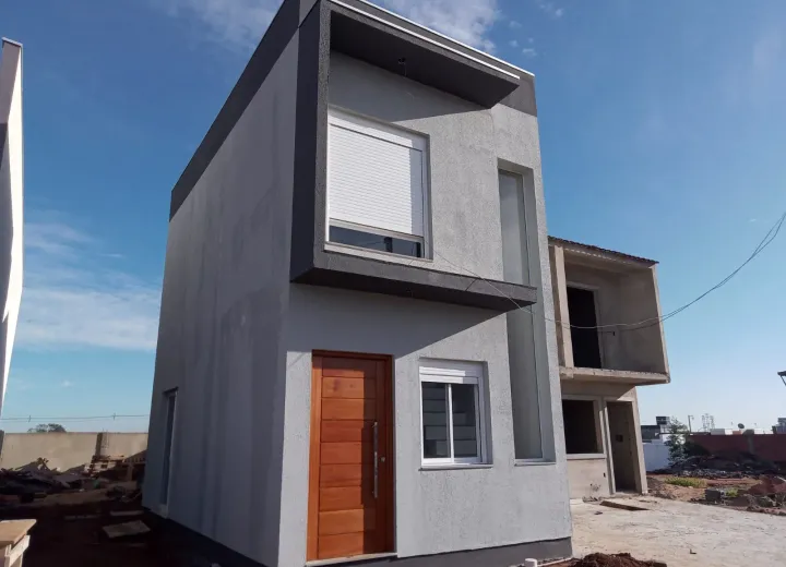 Casa de alvenaria com fachada contemporânea e esquadrias claras